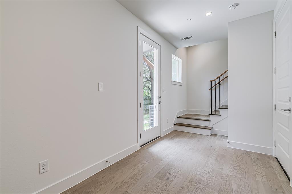 6028 Lewis Street, Unit 202 Dallas, TX 75206 - Photo 10 of 37 an empty room with windows