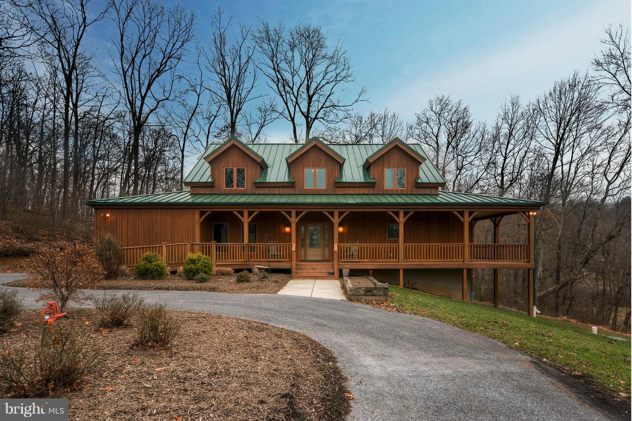 721 Lees Mill Road Upperco, MD 21155 - Photo 1 of 16 a front view of a house with a yard and garage