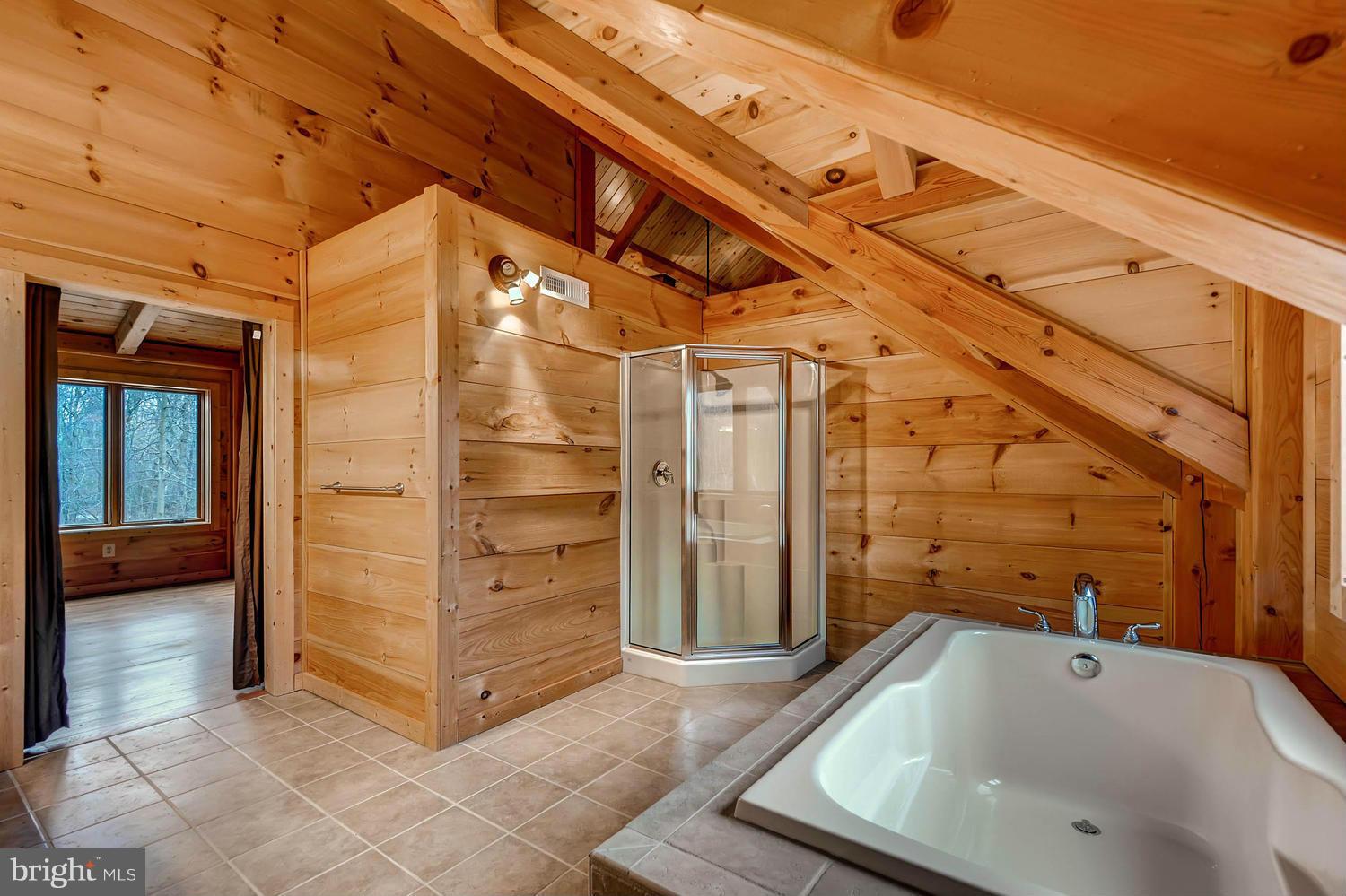 721 Lees Mill Road Upperco, MD 21155 - Photo 13 of 16 a bathroom with a tub and shower