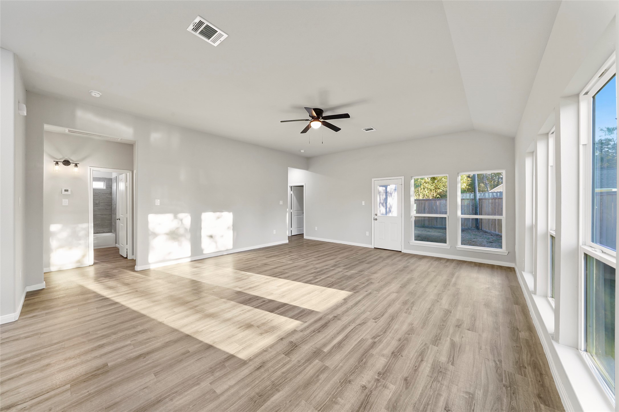 222 Spruce Lake Road Houston, TX 77336 - Photo 11 of 21 wooden floor in an empty room with a window