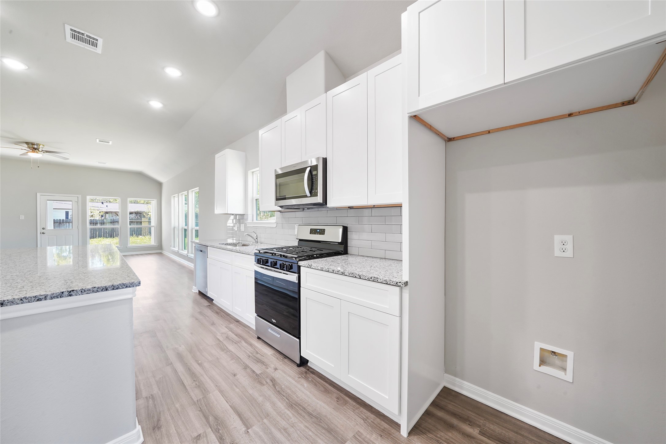 222 Spruce Lake Road Houston, TX 77336 - Photo 7 of 21 a kitchen with stainless steel appliances granite countertop a stove a sink and a refrigerator