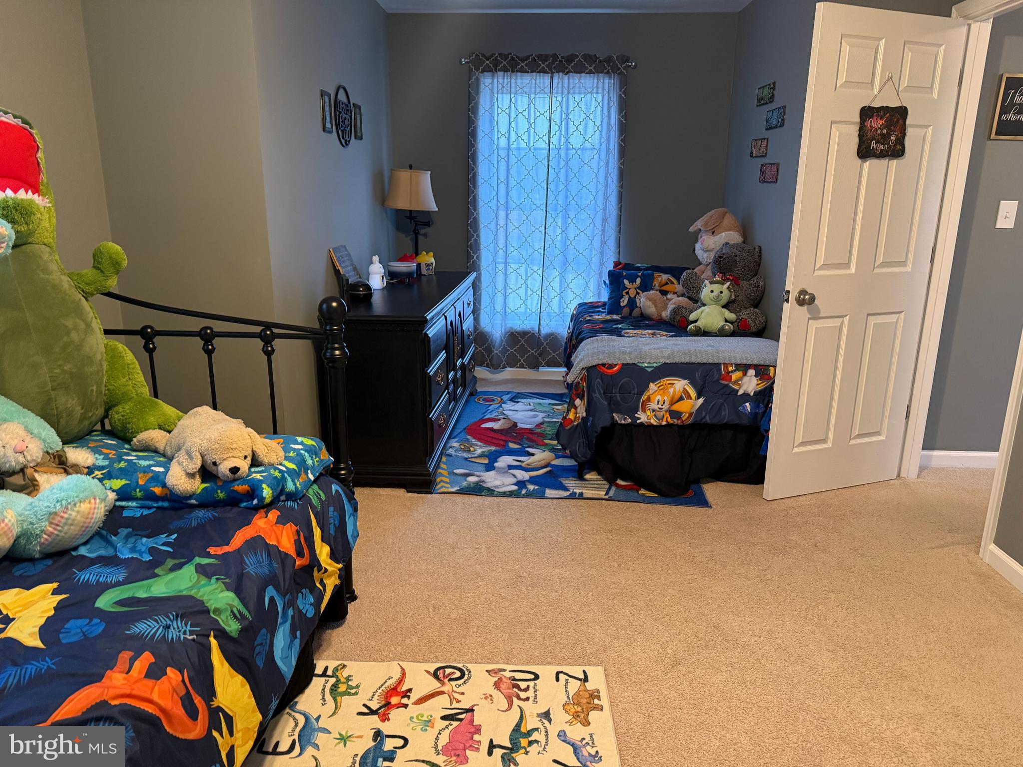 113 State Street Sharptown, MD 21861 - Photo 11 of 18 a living room filled with furniture and a baby crib