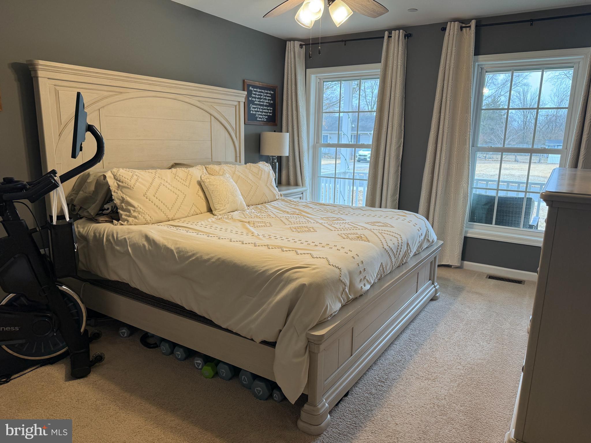 113 State Street Sharptown, MD 21861 - Photo 7 of 18 a bed sitting in a bedroom next to a window