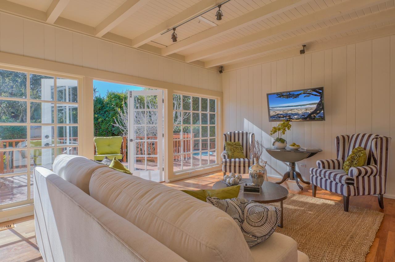 24770 Valley Way Carmel, CA 93923 - Photo 14 of 39 a living room with furniture and a floor to ceiling window