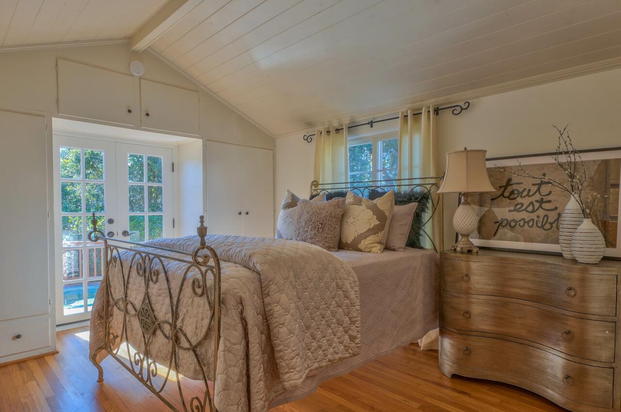 24770 Valley Way Carmel, CA 93923 - Photo 17 of 39 a bed room with furniture and a window