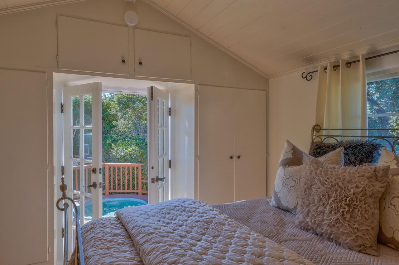 24770 Valley Way Carmel, CA 93923 - Photo 18 of 39 a bedroom with a bed and a window