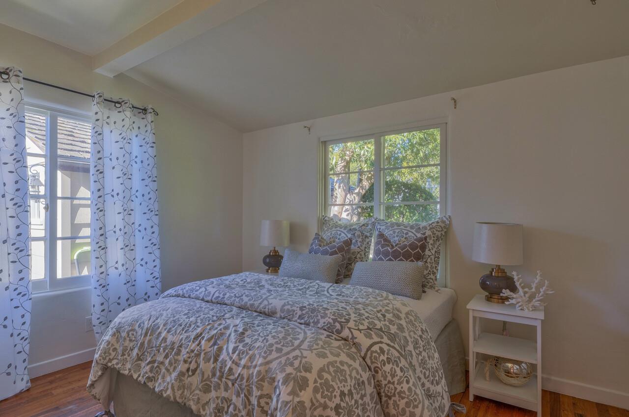 24770 Valley Way Carmel, CA 93923 - Photo 20 of 39 a bedroom with a bed and a window