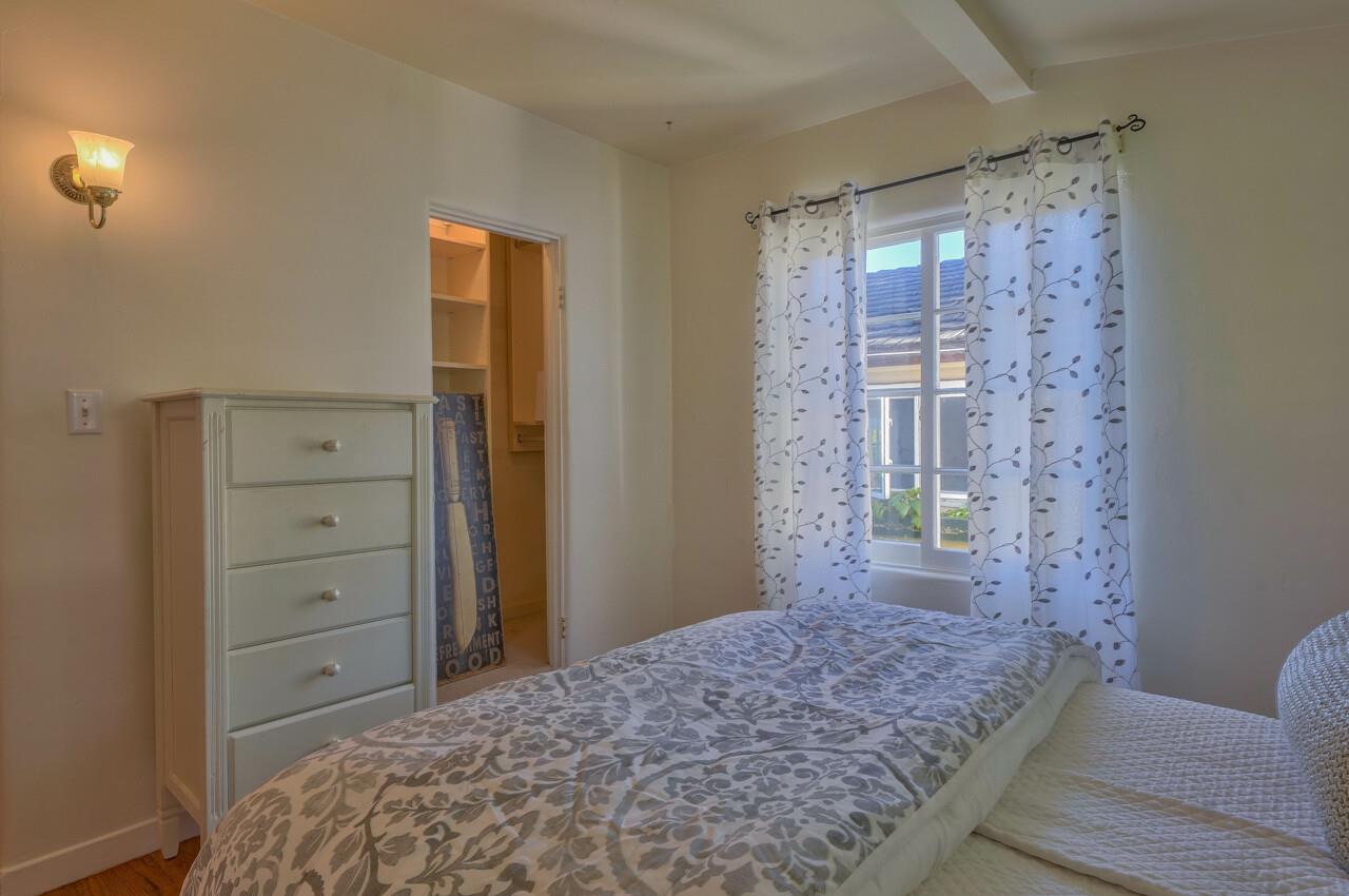 24770 Valley Way Carmel, CA 93923 - Photo 21 of 39 a bedroom with a bed and a dresser in it