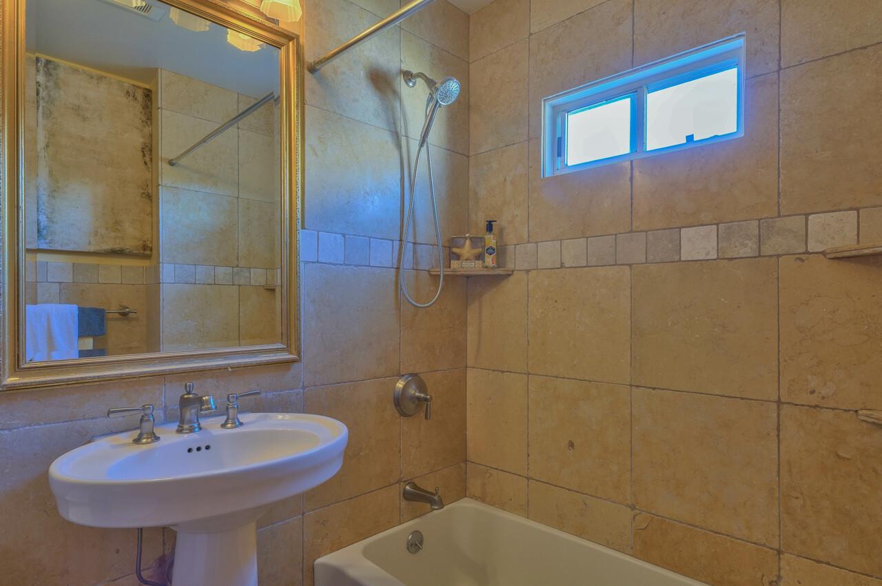 24770 Valley Way Carmel, CA 93923 - Photo 22 of 39 a bathroom with a sink and a mirror