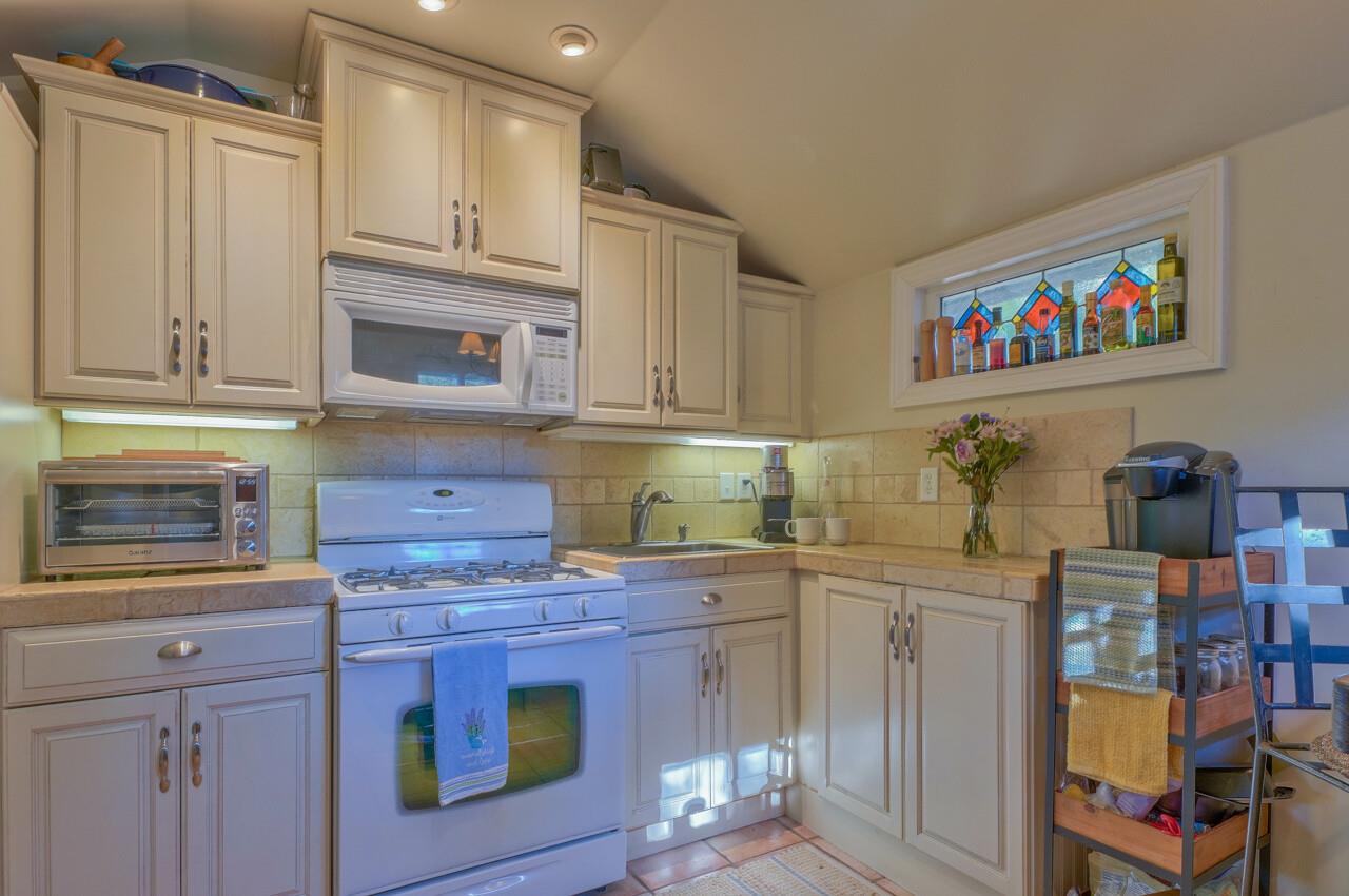 24770 Valley Way Carmel, CA 93923 - Photo 35 of 39 a kitchen with stainless steel appliances granite countertop a stove and cabinets