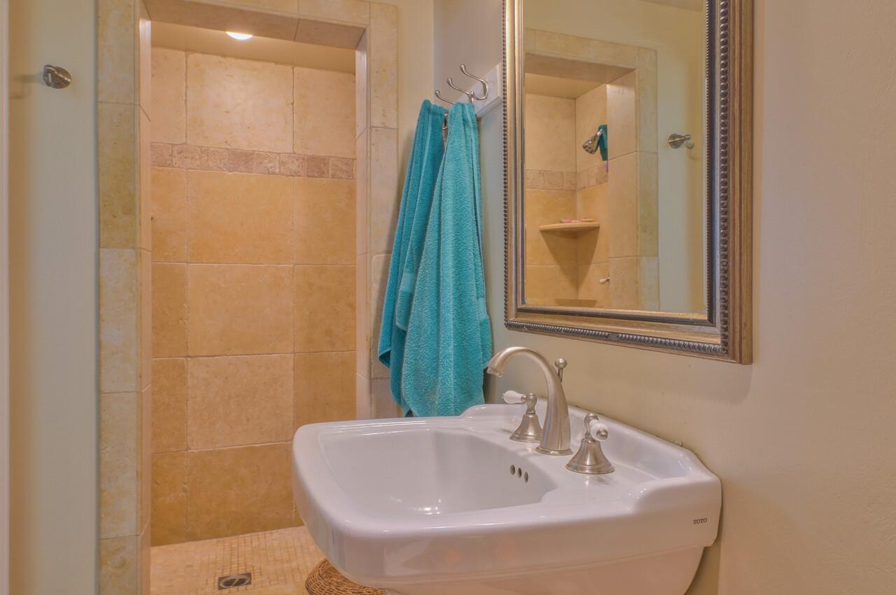 24770 Valley Way Carmel, CA 93923 - Photo 36 of 39 a bathroom with a sink and a mirror