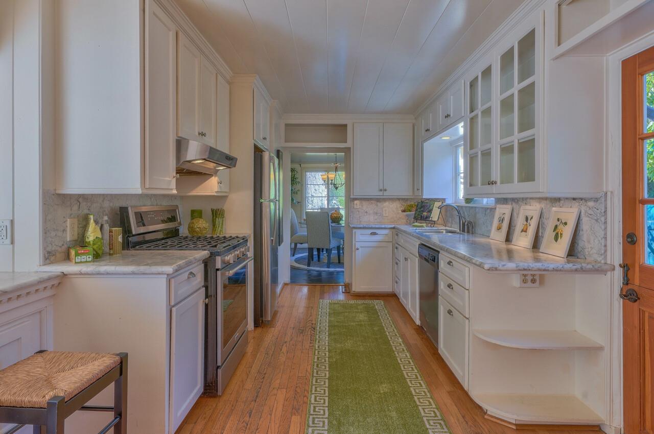 24770 Valley Way Carmel, CA 93923 - Photo 9 of 39 a kitchen with a stove a sink and a refrigerator