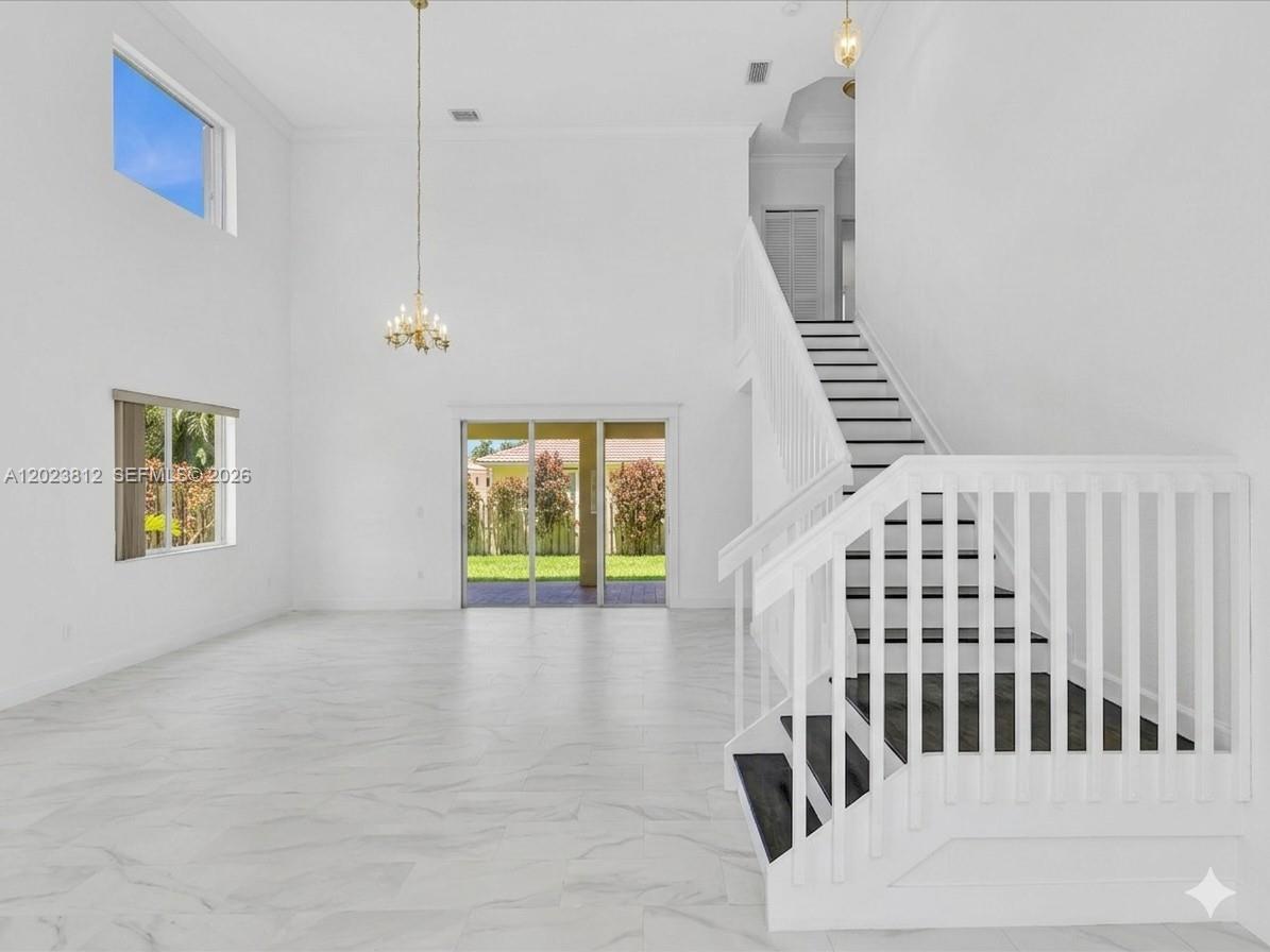 2864 Southwest 138th Path Miami, FL 33175 - Photo 10 of 40 a view of an entryway with wooden floor