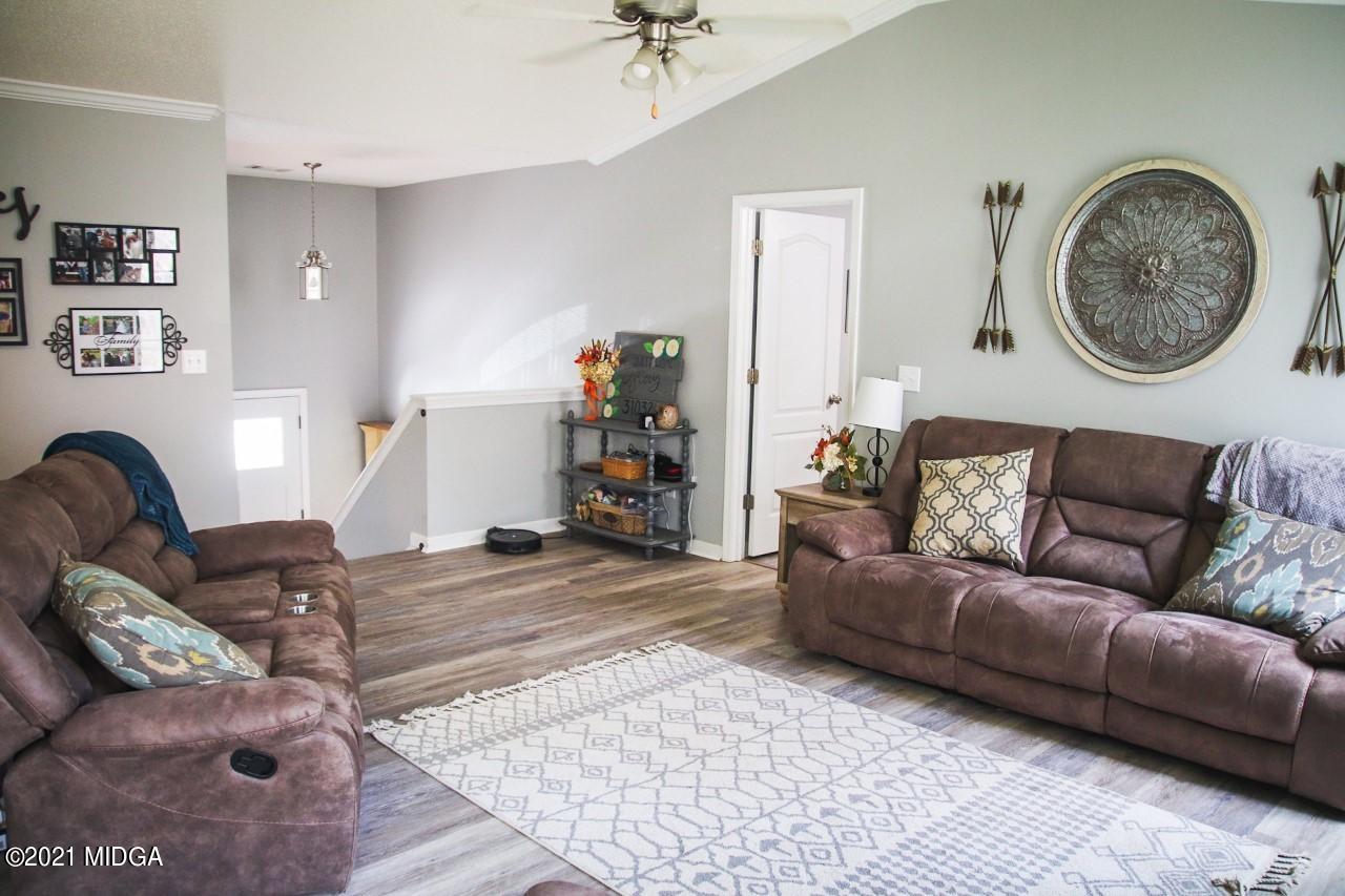 3369 Trotters Ridge Trail Gray, GA 31032 - Photo 4 of 13 a living room with furniture and a couch