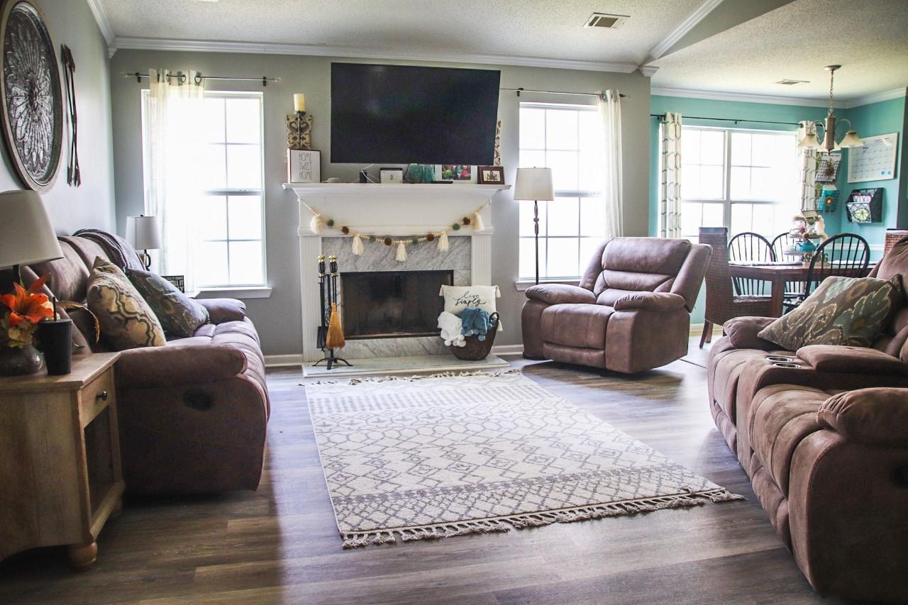3369 Trotters Ridge Trail Gray, GA 31032 - Photo 5 of 13 a living room with furniture a flat screen tv and a fireplace