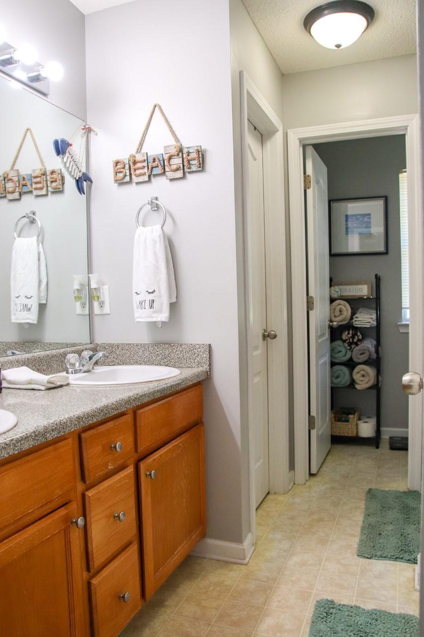 3369 Trotters Ridge Trail Gray, GA 31032 - Photo 6 of 13 a bathroom with a sink a vanity and a mirror