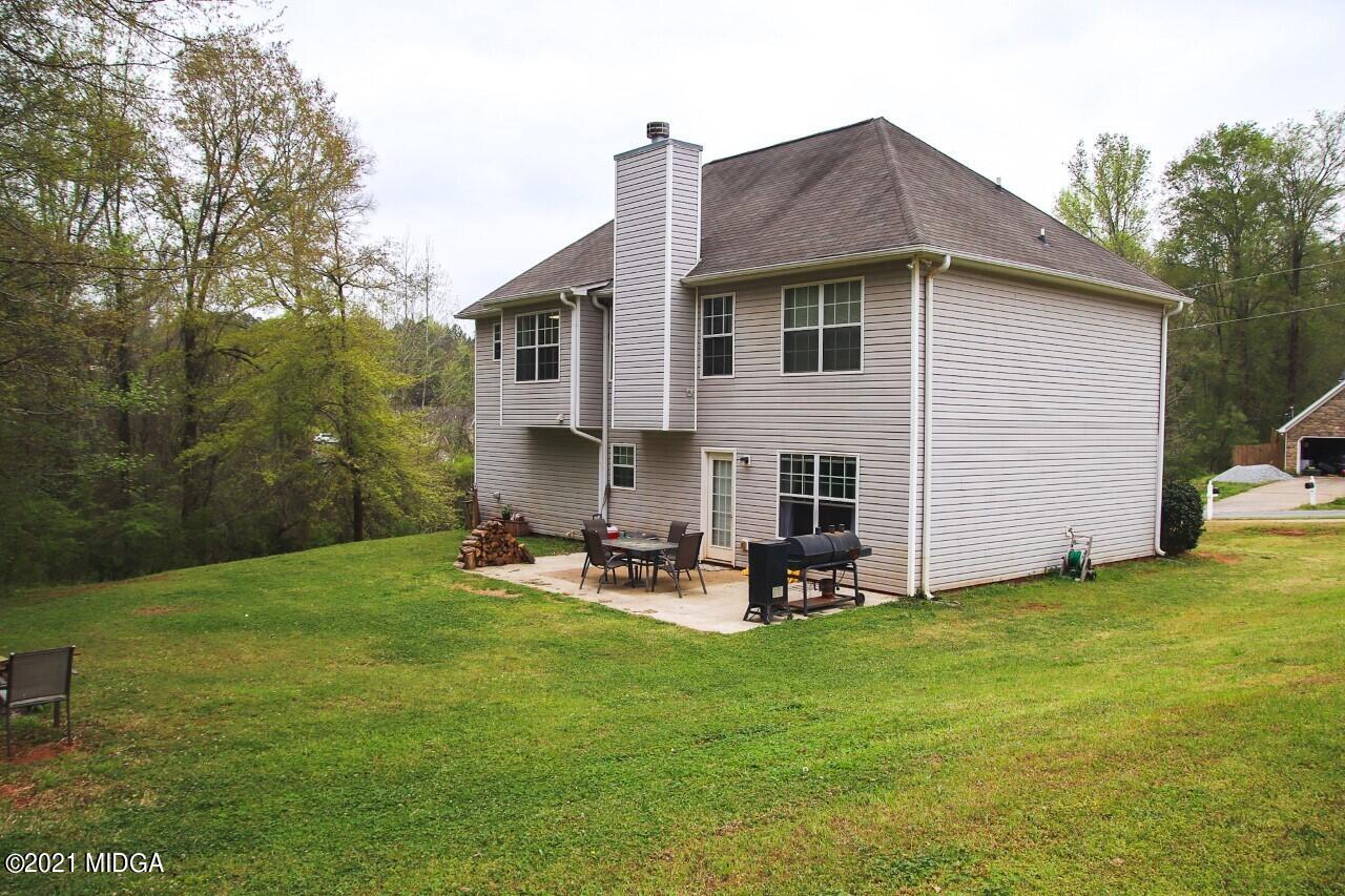 3369 Trotters Ridge Trail Gray, GA 31032 - Photo 8 of 13 a view of a house with backyard