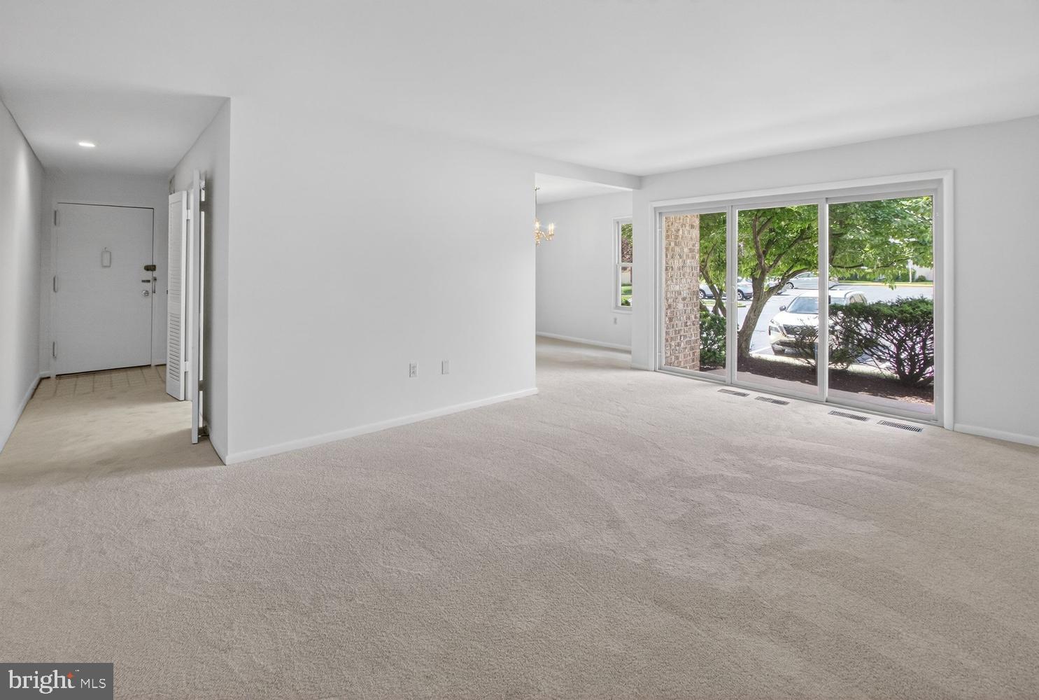 3406 Chiswick Court, Unit 472A Silver Spring, MD 20906 - Photo 2 of 31 Large living room with slider to patio