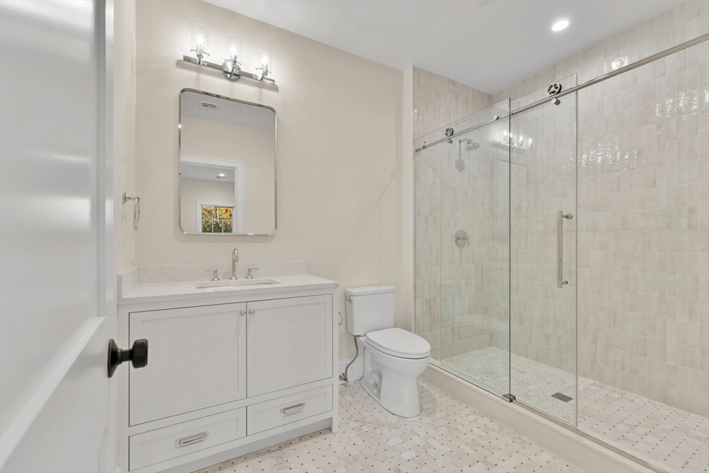 8 Crestview Road Needham, MA 02492 - Photo 20 of 30 a bathroom with a toilet a sink and a mirror