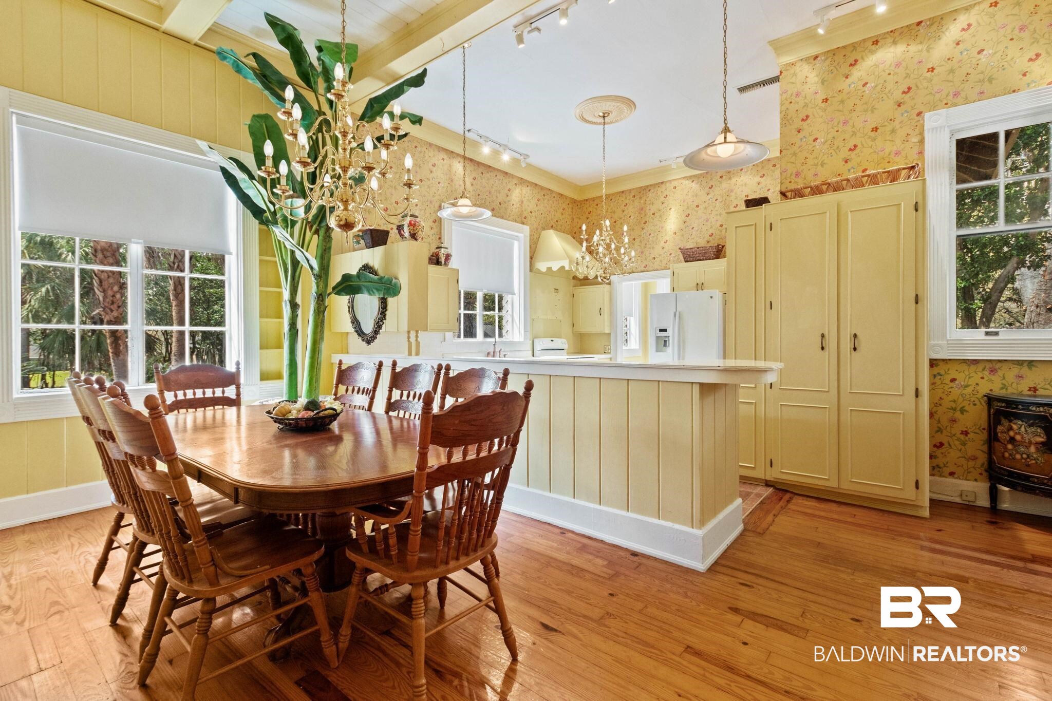 1701 Sowell Road Brewton, AL 36426 - Photo 32 of 83 Dining room featuring light wood finished floors, plenty of natural light, suspended lighting, and wallpapered walls
