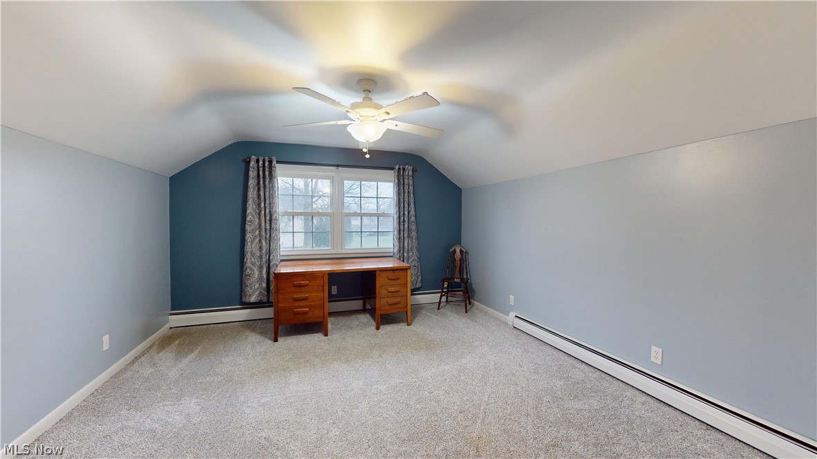 12326 Huntoon Road Painesville, OH 44077 - Photo 26 of 38 Additional living space with light colored carpet, ceiling fan, vaulted ceiling, and baseboard heating