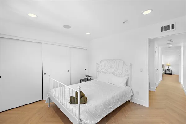 a bedroom with a bed and a table