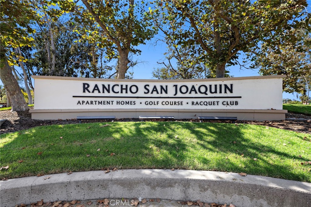 18 Navarre, Unit 133 Irvine, CA 92612 - Photo 21 of 32 a sign that is sitting on a brick wall