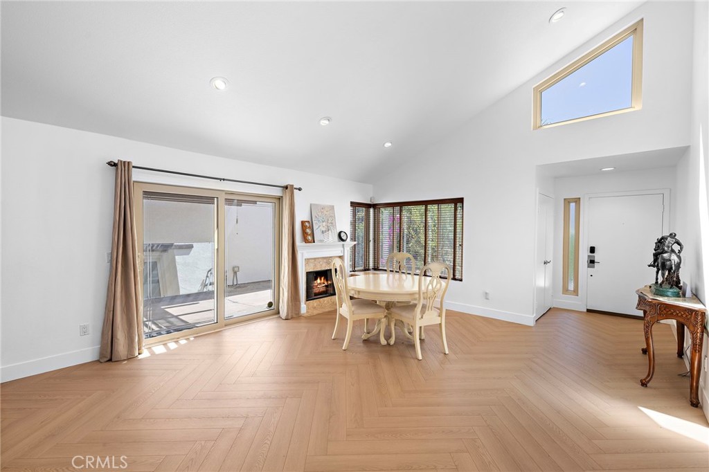 18 Navarre, Unit 133 Irvine, CA 92612 - Photo 5 of 32 a dining room with furniture and wooden floor