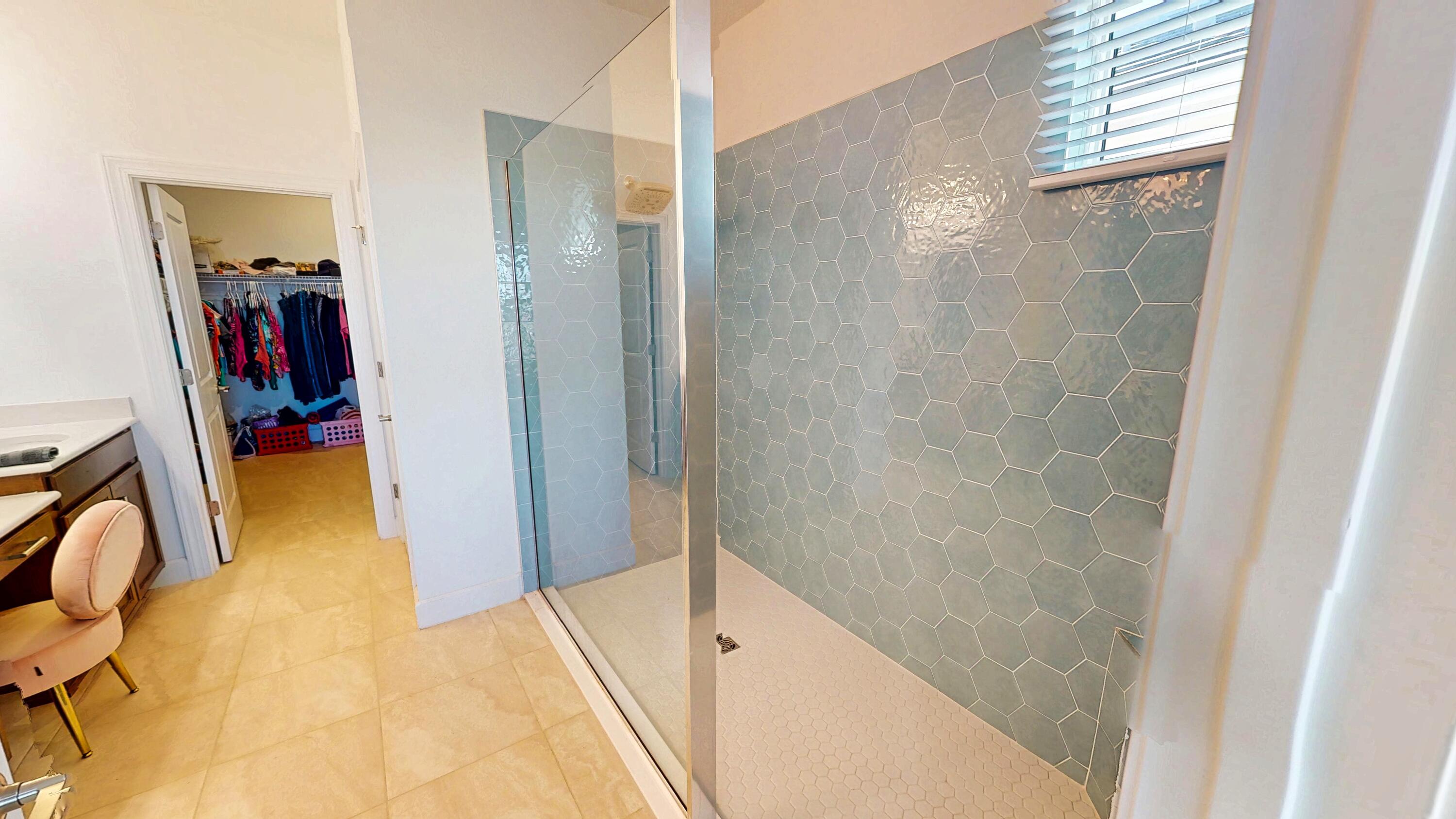 9876 Santini Road Port St. Lucie, FL 34987 - Photo 11 of 45 a bathroom with a tub and a shower
