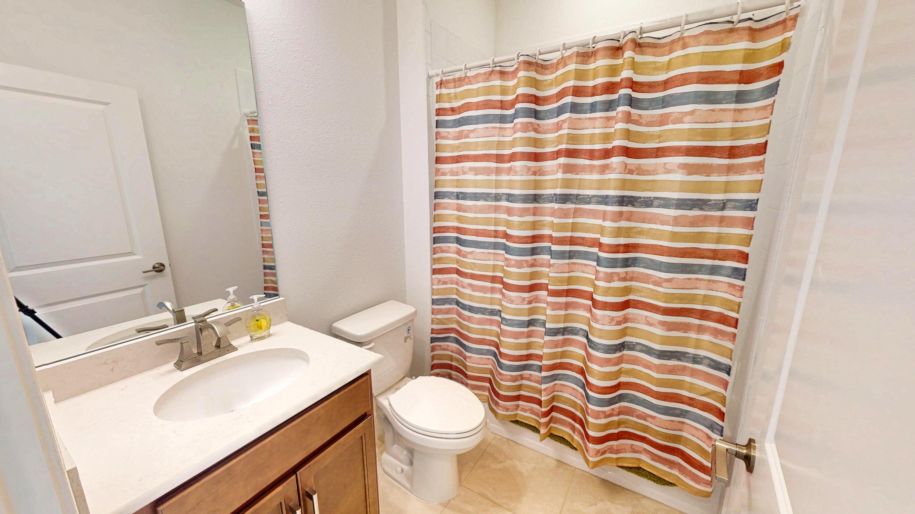 9876 Santini Road Port St. Lucie, FL 34987 - Photo 19 of 45 a bathroom with a sink toilet and shower