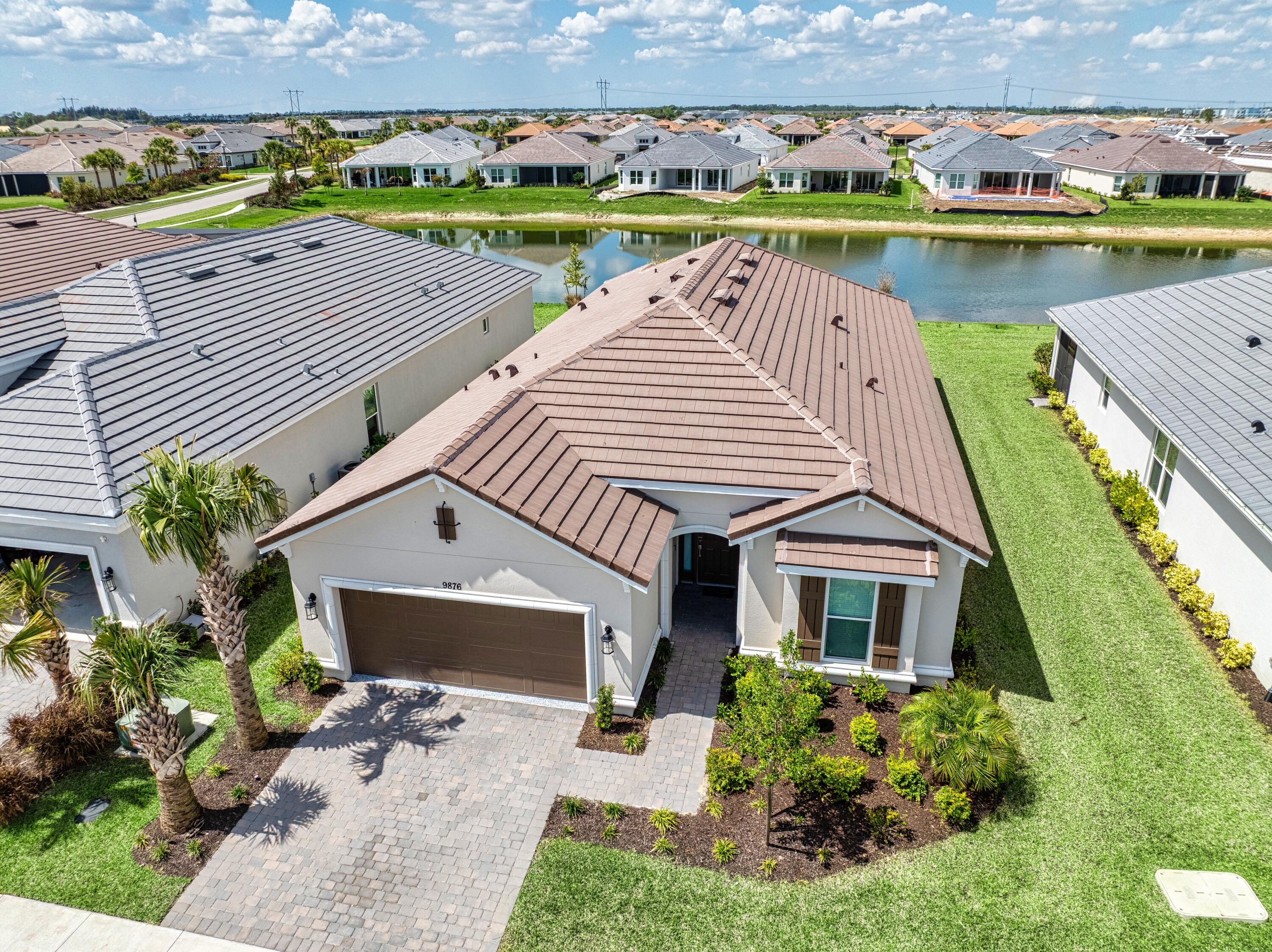 9876 Santini Road Port St. Lucie, FL 34987 - Photo 24 of 45 an aerial view of a house with a ocean view