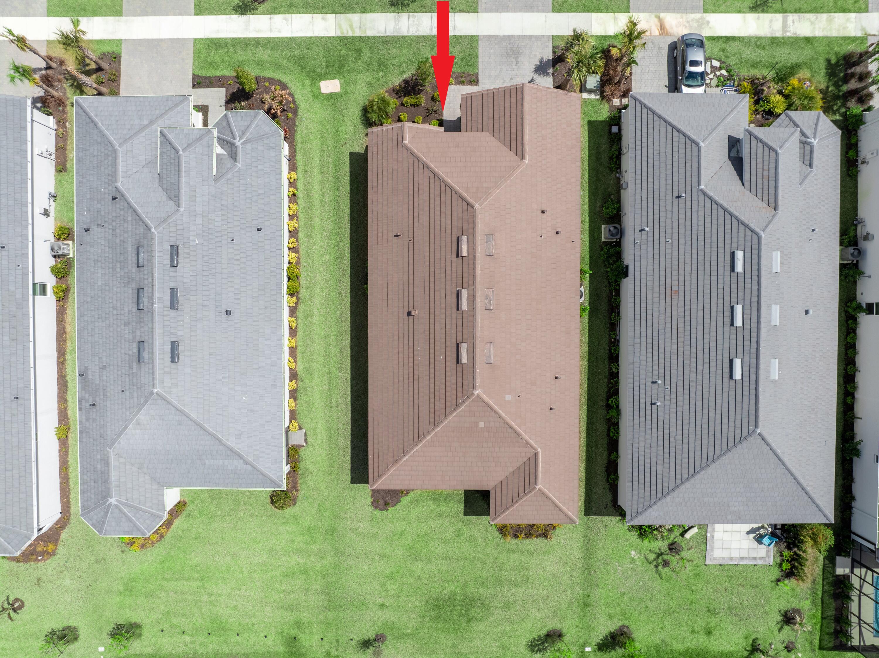 9876 Santini Road Port St. Lucie, FL 34987 - Photo 29 of 45 a aerial view of a house with a yard and garage