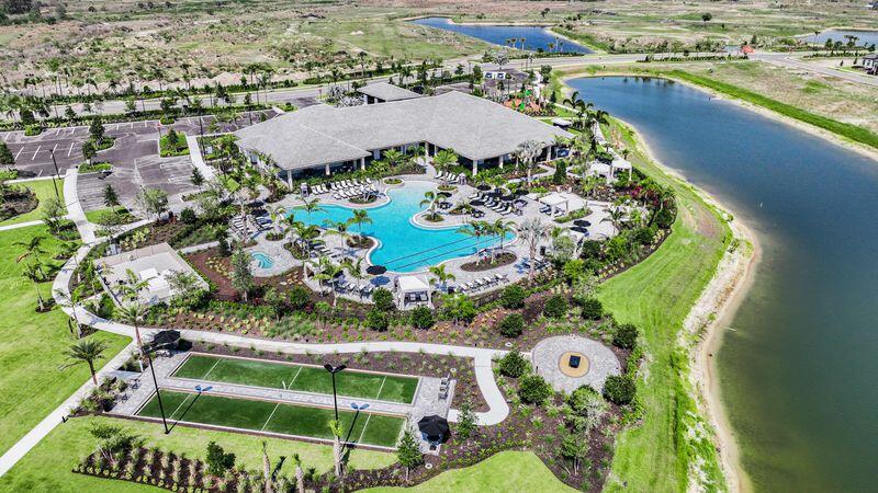 9876 Santini Road Port St. Lucie, FL 34987 - Photo 36 of 45 an aerial view of residential houses with outdoor space and swimming pool