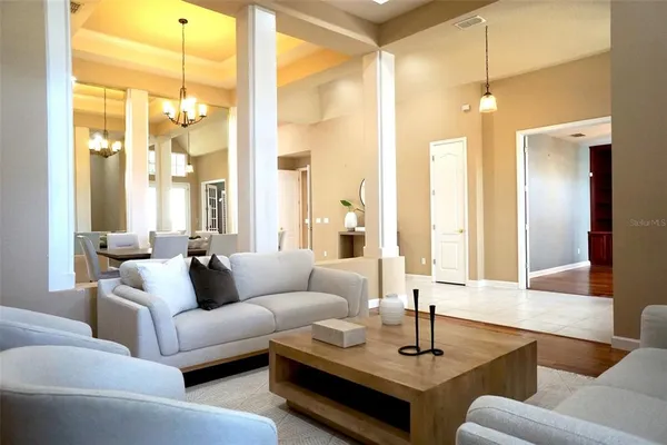 a living room with furniture and a large window