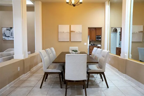 a dining room with furniture and window