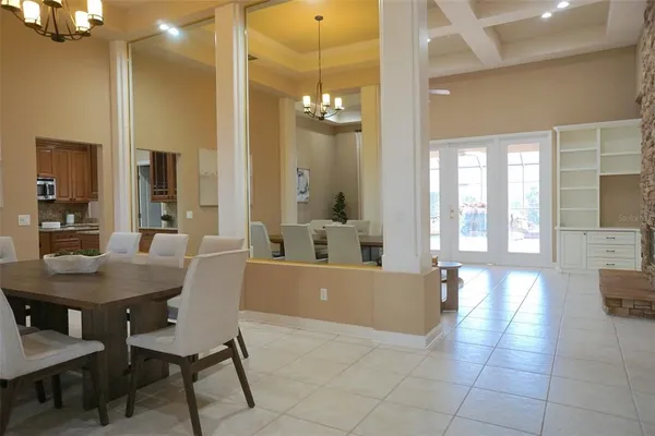 a view of a dining room with furniture and a large window