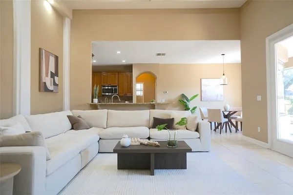 a living room with furniture and a large window