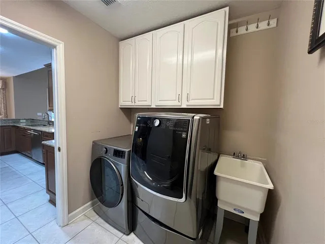 a utility room with dryer and washer