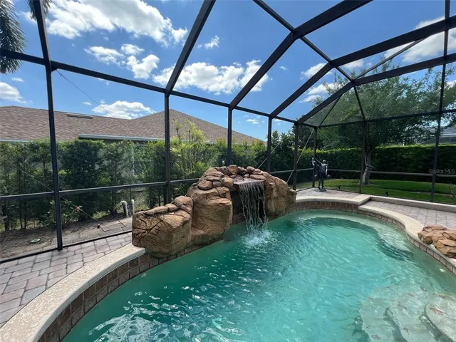 a view of a couches in patio with a yard