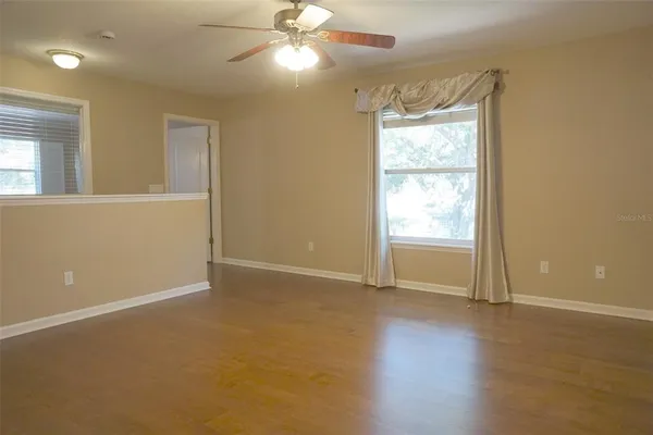 a view of an empty room with a window