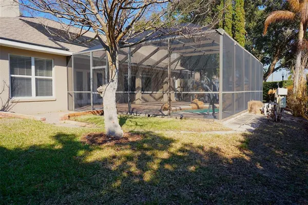 a backyard of house with garden and patio