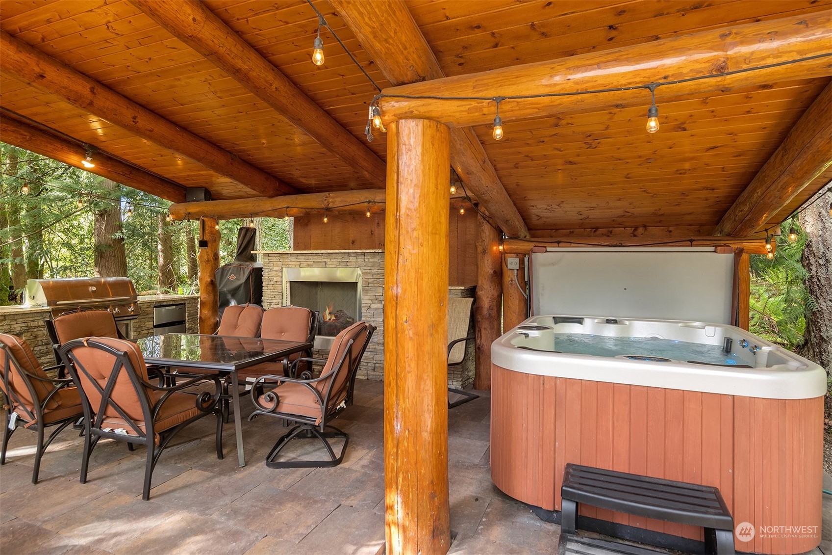 24221 Northeast Union Hill Road Redmond, WA 98053 - Photo 24 of 40 a dining room with furniture and a fireplace
