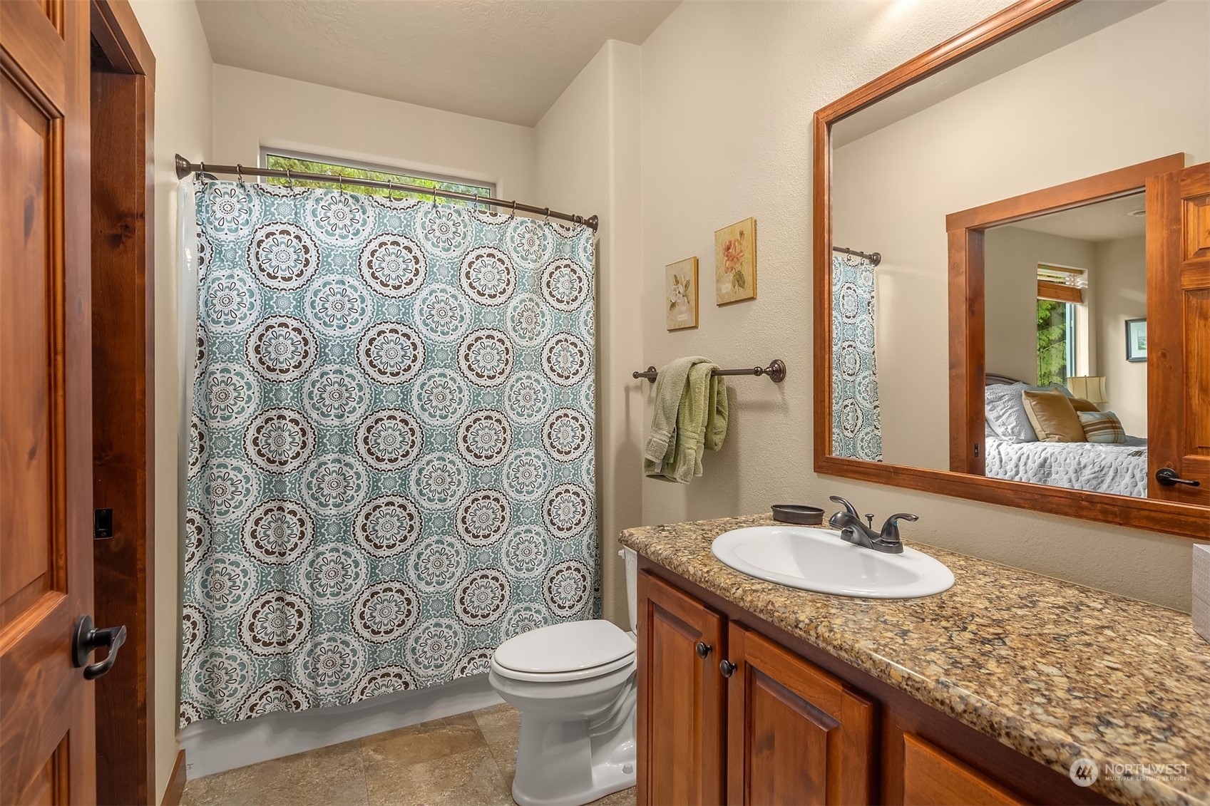 24221 Northeast Union Hill Road Redmond, WA 98053 - Photo 29 of 40 a bathroom with a granite countertop sink and a mirror