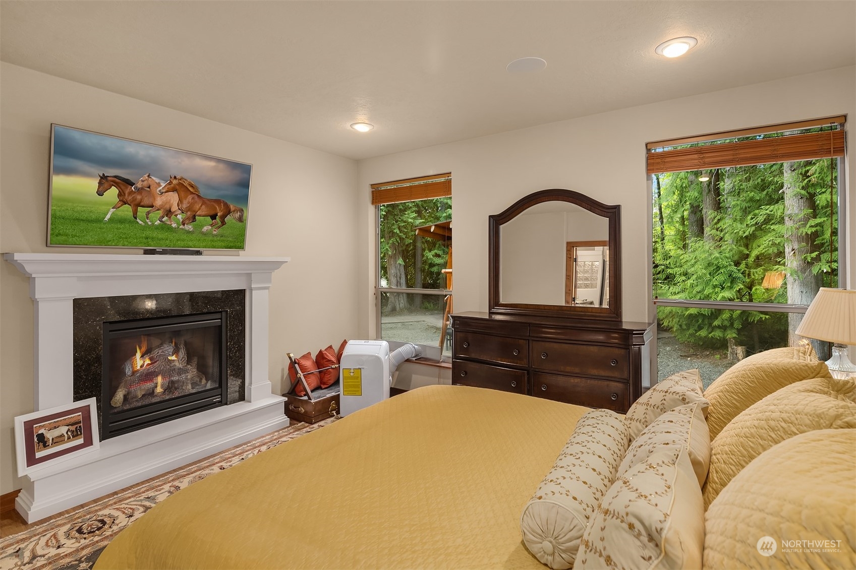 24221 Northeast Union Hill Road Redmond, WA 98053 - Photo 35 of 40 a bedroom with a bed and a fireplace