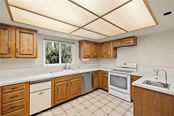 a kitchen with a sink stove and cabinets