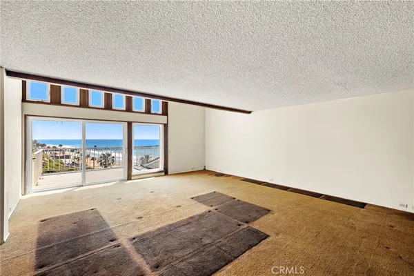 an empty room with large window