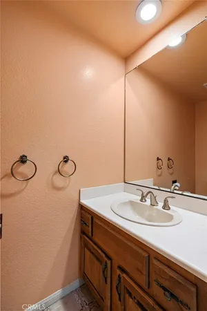 a bathroom with a sink and mirror