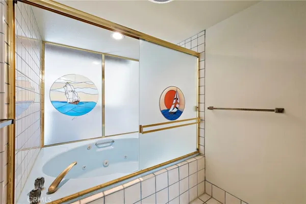 a picture of a bathroom with a sink and a mirror