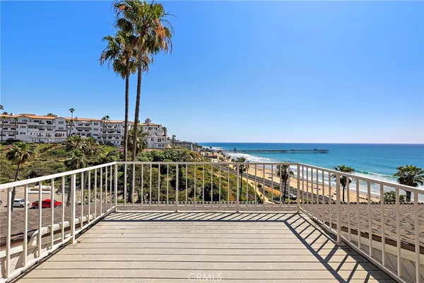 a view of a balcony with an ocean view