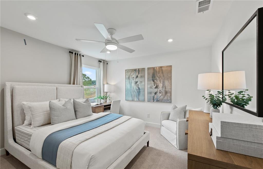 810 Tupelo Way Villa Rica, GA 30180 - Photo 28 of 41 a bedroom with a large bed and a large window